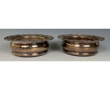 A pair of silver plated bottle coasters, two canteens of silver cutlery and other silver plate (box) 