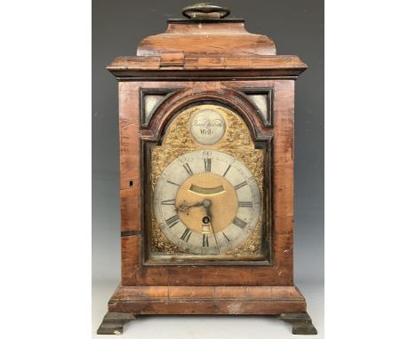 A bracket clock, the arched brass dial signed Isaac Nickals, Wells, the silvered chapter ring with Roman numerals, a subsidia