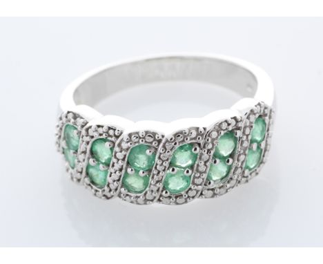Sterling silver emerald ring , set with twelve round emeralds.  Item Specifications: Clarity: . Metal: Silver.  Ring Size N (