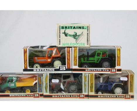 Four boxed Britains 1:32 metal and plastic tractors to include nos 9528, 9524, 9526 &amp; 9522, together with boxed Muledozer