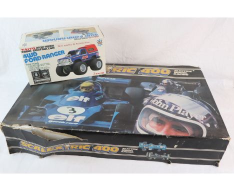 Boxed Scalextric 400 Electric Model Racing Set, with 2 slot cars (rip to box), together with a boxed Taiyo Radio Controlled 4