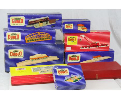 Nine boxed Hornby Dublo trackside accessories to include D1 Through Station, D1 Island Platform, 5005 Engine Shed Kit (2 road
