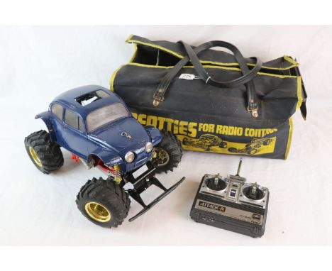 Vintage Tamiya electric 1/10 scale Monster Beetle monster truck on a Blackfoot chassis together with Futaba attack-r period c