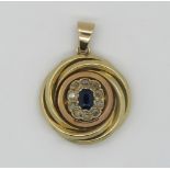 1 Anhänger GG 14ct. zentral wohl Saphir ca. 5,5x4mm, Diamantkranz, Gesamtlänge des Anhängers ca. 3,5