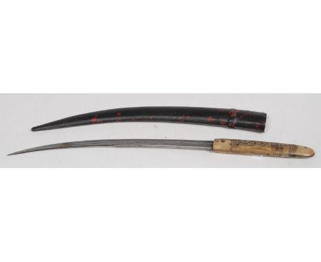 An Indian/Middle Eastern dagger, 32.5cm curved fullered blade engraved with scrolls/script, the horn handle inlaid with brass