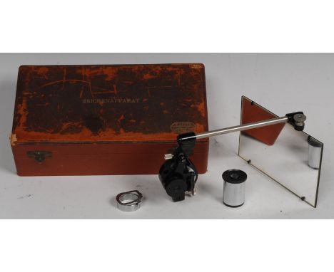 An E Leitz Wetzlar (Leica) camera lucida microscope attachment 13cm rectangular plate, adjustable lenses and clamp, the box i