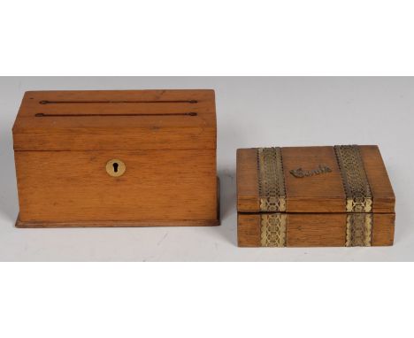 A late Victorian oak correspondence box, hinged cover with two letter apertures, enclosing twin compartments, brass escutcheo