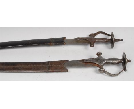 An 19th century Indian tulwar, 73cm curved blade with circular armourer's mark, steel hilt with serpentine guard and disc pom