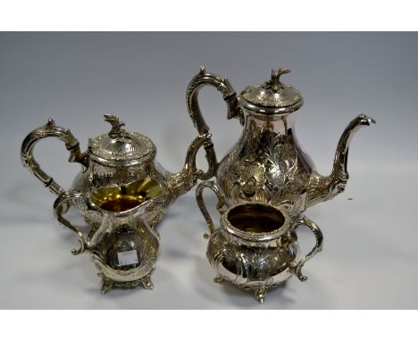An E.P.B.M.  four piece tea and coffee service, embossed and engraved with flowers and foliage,  bird finial, James Dixon and