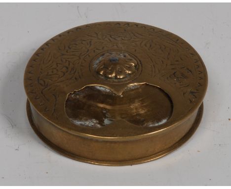 A World War I Damascus trench art circular snuff box. circular rotating cover with sliding aperture, chased with stylised lea