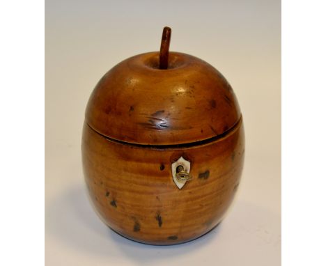 A fruitwood tea caddy, in the form of an apple, shield shaped escutcheon, 16.5cm high