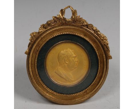 A 19th century gilt portrait medallion, after T Webb, commemorating the death of Charles James Fox, 1806, 7.5cm diam, framed