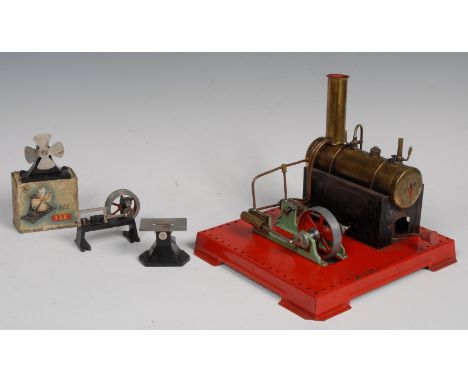A Mamod model stationary steam engine, brass boiler, mounted on a square base with circular saw and other accessories, 26cm w