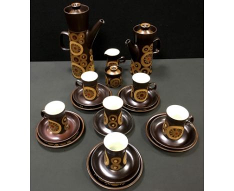 A Denby Arabesque coffee set for six comprising coffeepot, water jug, sucrier, creamer, five teaplates, coffee cups and sauce