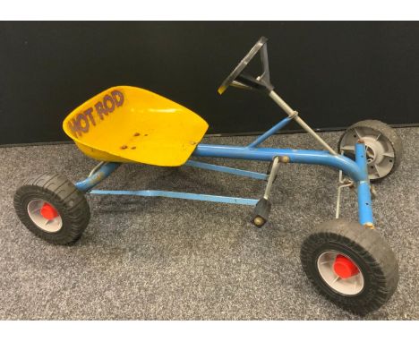 A vintage Raleigh Hotrod peddle powered go-cart, yellow and powder blue body, molded plastic tyres, 81cm long 