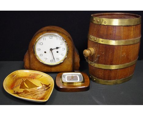 A mid 20th century oak cased mantel clock, white dial, mechanical movement;  a table top coopered barrel ; Poole Pottery Boat