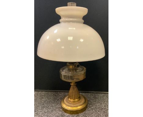 A Victorian Harrods Messenger Stores brass and clear glass oil lamp, opaque glass shade, 54cm high 