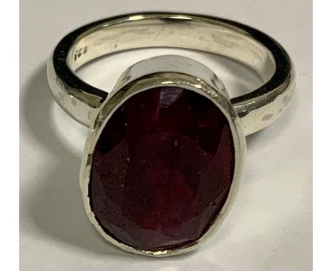 A ruby solitaire ring, oval mixed cut ruby approximately  10ct, 925 silver shank 
