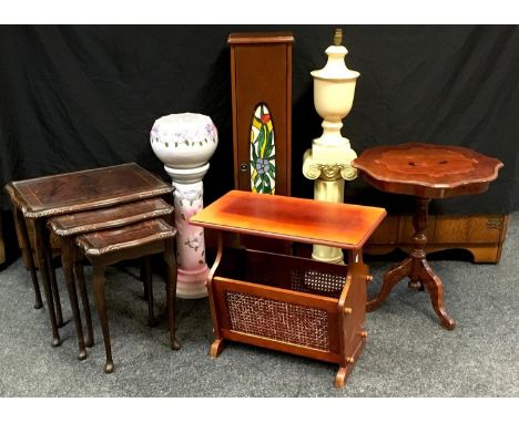 An Italian style inlaid tripod table, shaped circular top; nest of three mahogany tables, glass inlay; a jardinière &amp; sta