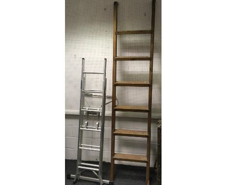 A pitch pine loft ladder (275cm long); an aluminium five way combination ladder(1.9m - 2.74m) with Trade Ladder Stand Off. (2