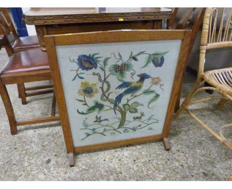 An oak framed needlework tapestry screen