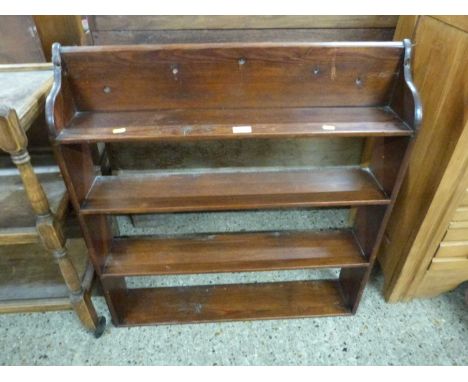 A stained pine four tier wall shelf