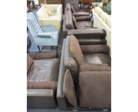 A modern, large brown leather, three seater sofa, a matching two seater sofa, a matching pouffe, a matching single armless ch