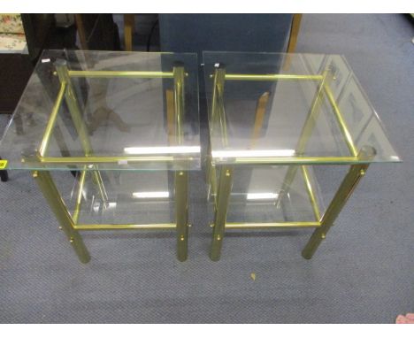 A pair of modern brass framed lamp tables with glass shelves, 22 h x 14 1/2 w x 14 1/2d
