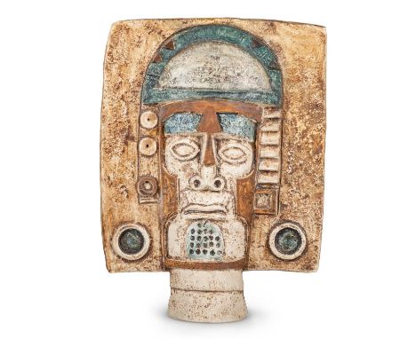PENNY BLACK FOR TROIKA POTTERY, AN AZTEC DOUBLE SIDED FACE MASK decorated in shades of brown, blue, white and green, painted 