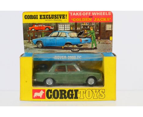 Corgi - A boxed Golden Jacks Rover P6 2000 TC # 275. The model appears Mint in a Good box with some storage wear and light cr