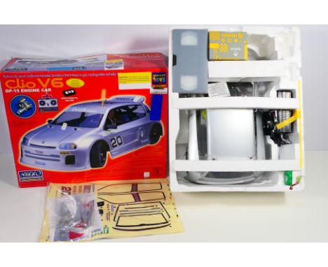 Nikko - A boxed Nikko 'Renault Toys' 1:8 scale Renault Clio V6 petrol engine RC car. The official Renault 'dealership' model 