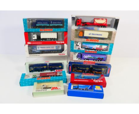 Herpa - AMW - A collection of 13 boxed HO/1:87 scale plastic model trucks. Lot includes Herpa Volvo FH16XL 'Grizzly Snow Grip