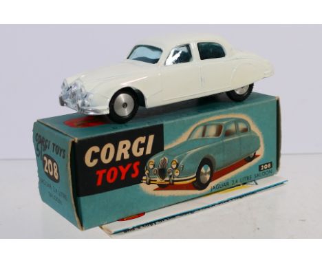 Corgi - A boxed Jaguar 2.4 Litre Saloon in white # 208. The car appears Near Mint with just some minor age spots on the base.