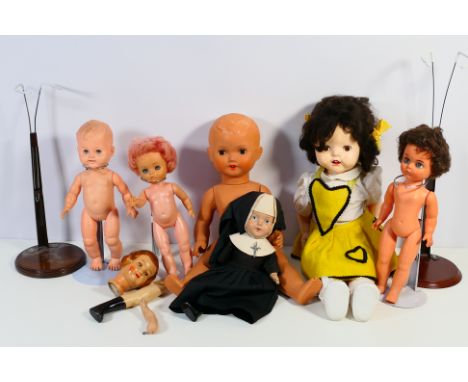 Unmarked Makers - A group of unboxed and unmarked composition and plastic dolls, some marked 'Made in England'. Sizes range f