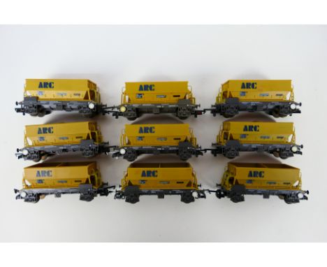 Lima - An unboxed rake of nine Lima 50T PGA aggregate hoppers 'AR14214' in ARC Amey Roadstone livery. Items appear to be in V