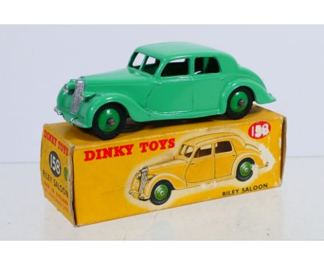 Dinky Toys - A boxed Dinky Toys #158 Riley Saloon. The model with green body and mid green hubs, has a small chip to rear of 