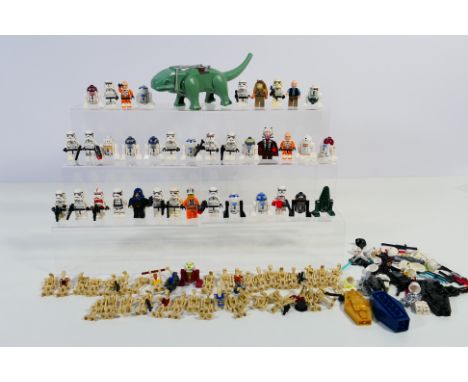Lego - Approximately 70 loose Lego 'Star Wars' minifigures and a loose group of Lego minifigure accessories such as legs, hel
