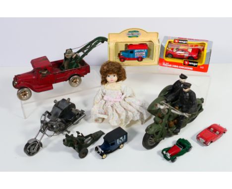 Arcade - Corgi - Matchbox - A group of toys including a cast iron tow truck marked Arcade Freeport Illinois, a Harley Davidso