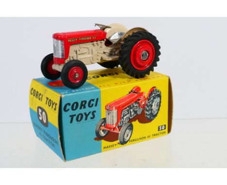 Corgi - A boxed Massey Ferguson 65 Tractor # 50. The model has a few marks and appears Very Good overall in a Good box with s