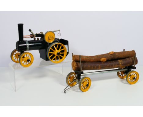 Mamod - An unboxed and constructed Mamod TWK1 with log trailer. The model appears never to have been fired and comes with bur