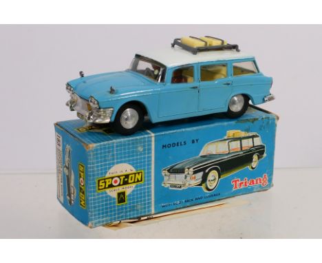 Spot-On - A boxed Tri-ang Spot-On #1183 Humber Super Snipe Estate Car. The model in light blue with white roof, yellow interi
