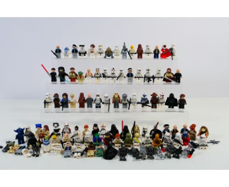 Lego - A loose brigade of approximately 100 Lego 'Star Wars' minifigures. Lot includes Luminara Unduli; Darth Maul Santa; Obi