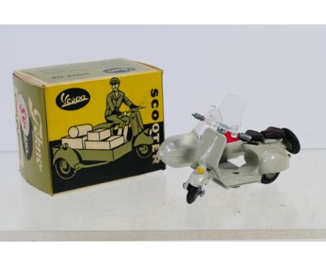 Tekno - A rare boxed Vespa De Luxe 25 Scooter with Sidecar # 443. This model appears in Near Mint condition with a couple of 