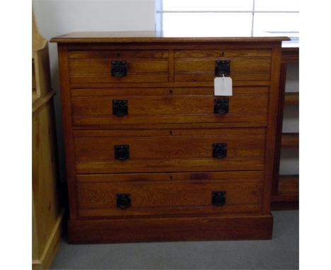 Edwardian Art Nouveau chest of two short and three long graduated drawers, the top with inset quadrant moulding, the drawers 