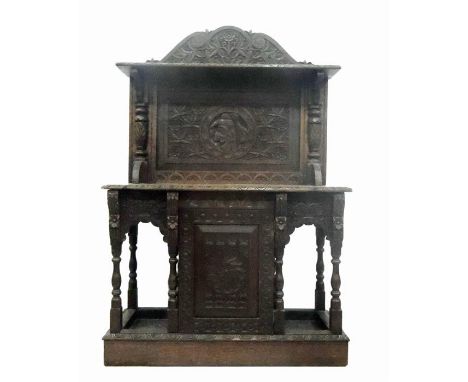 19th century carved oak revived Renaissance style cupboard with overall foliate carving, open shelf back, the central cupboar