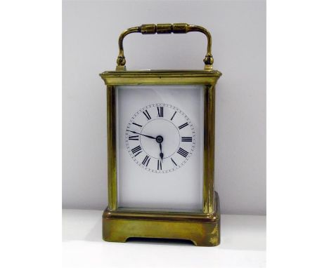 Brass carriage clock in corniche case, with striking movement, 18cm high over the handle 
