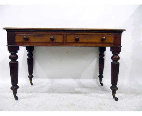 Mid 19th century mahogany side table fitted two drawers to frieze, each with turned knob handles, on turned and reeded taperi