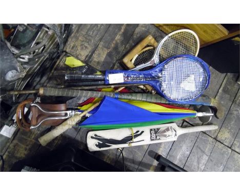 Various squash racquets, a Slazenger 600 cricket bat, a Pro-Spec hockey stick and a shooting stick with a golf umbrella attac