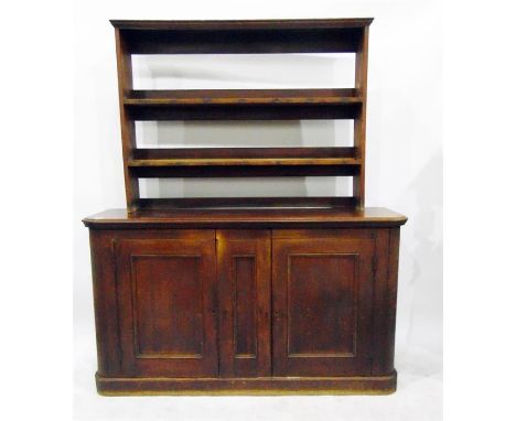 Victorian mahogany storage cupboard with moulded edge top, the three panelled doors below enclosing shelves, on a plinth base