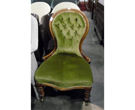 Lady's Victorian deep button upholstered, spoon-back nursing/salon chair on turned supports and brass castors   